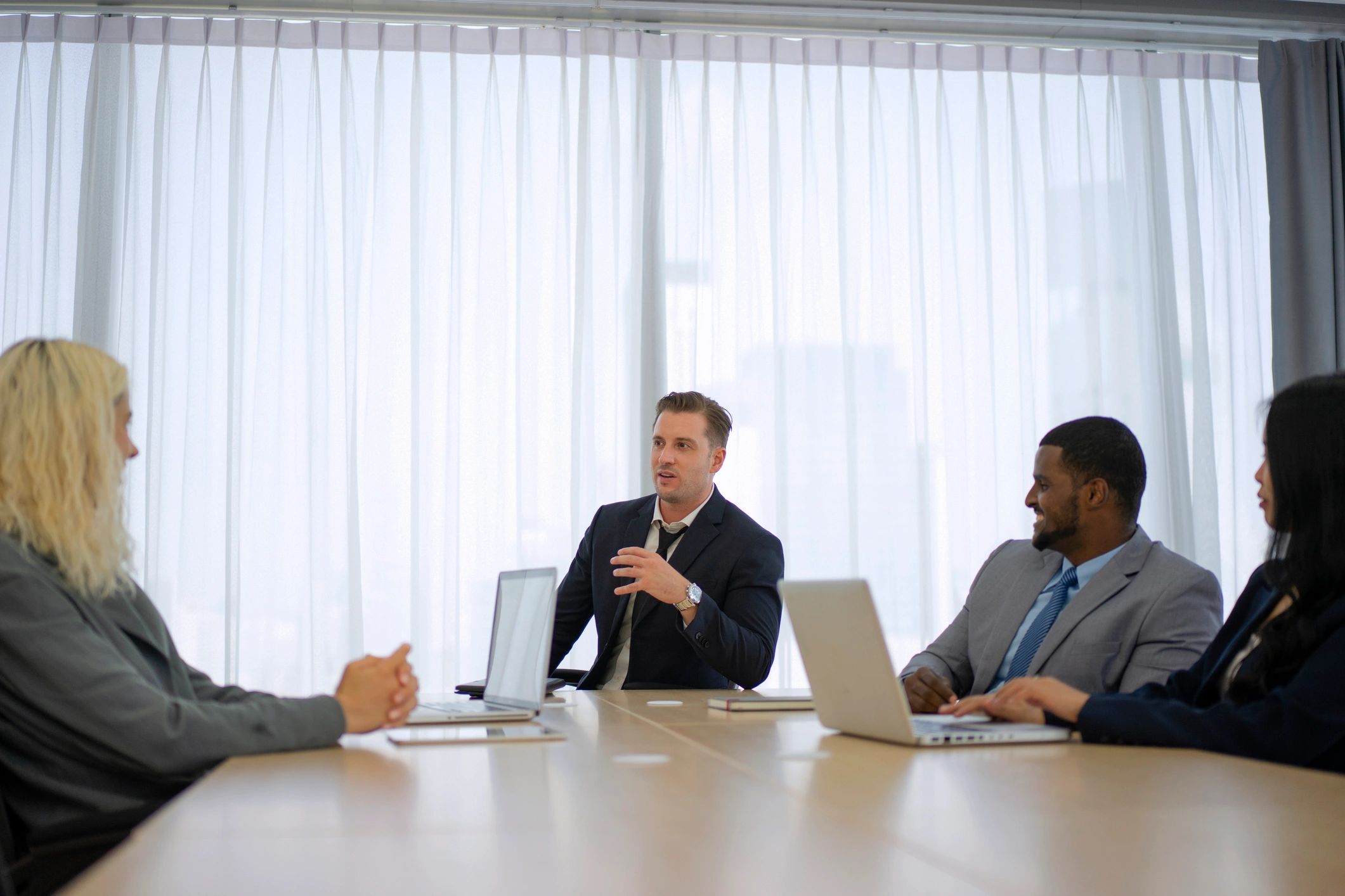 Business professional in a meeting room representing client perspective