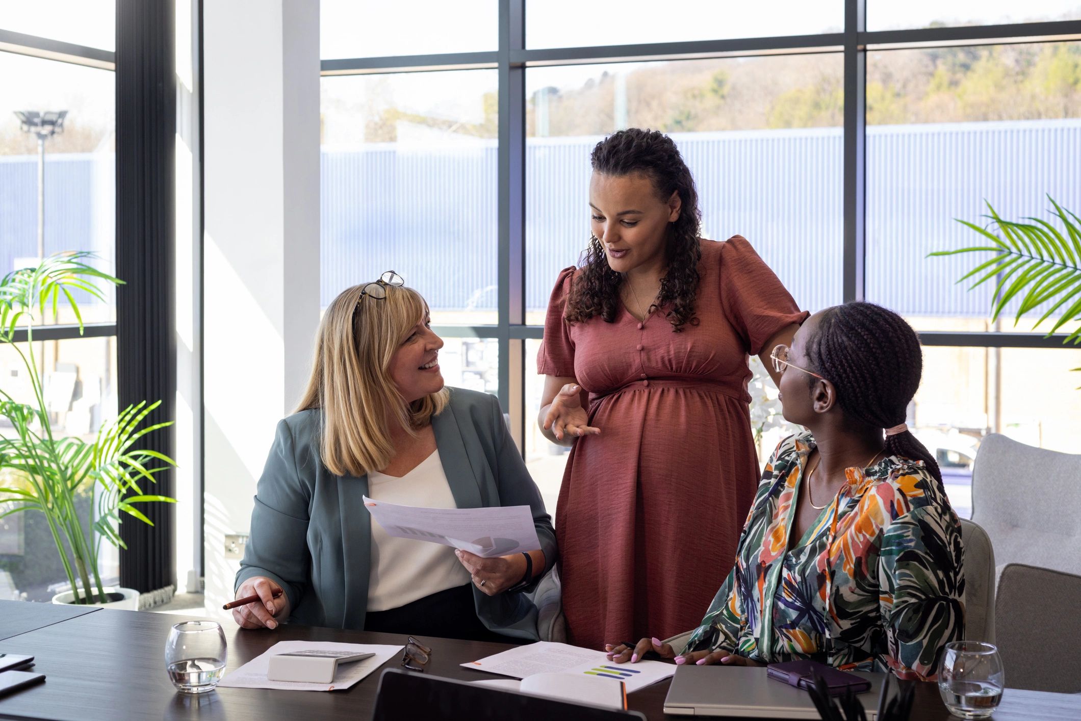 Consulting team collaborating in a bright conference room